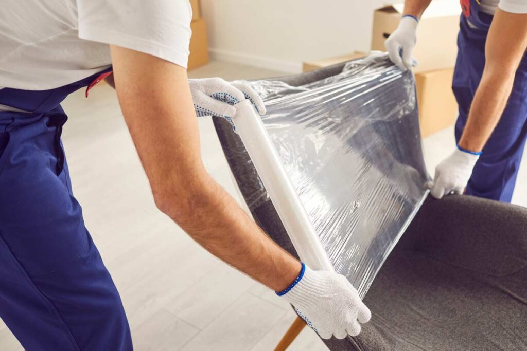 people putting paper in a furniture to make a moving