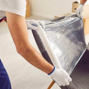 MSOF-Moving-Decomission people putting paper in a furniture to make a moving
